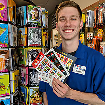 Guy holding stamps